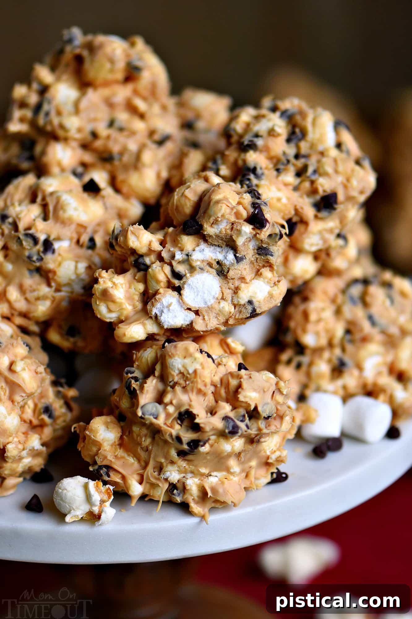 No Bake Avalanche Popcorn Treats are a must-make for the holiday season! Peanut butter, popcorn, marshmallows and chocolate chips combine for an easy, no bake treat that everyone will love! // Mom On Timeout