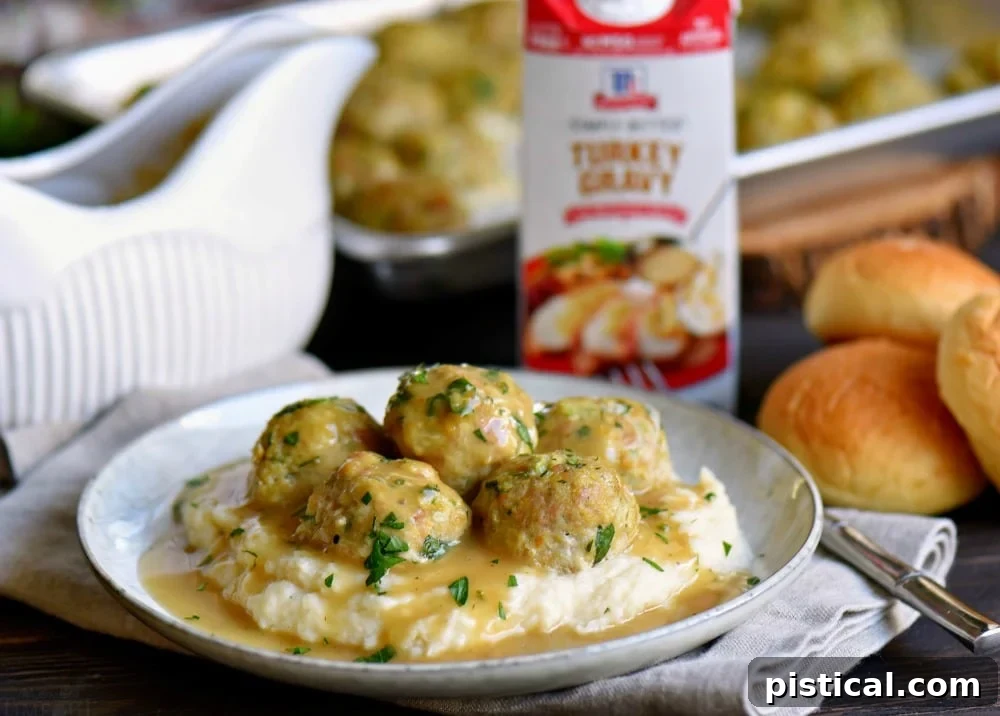A family-friendly plate with baked turkey meatballs and herbed gravy, ready to be enjoyed.