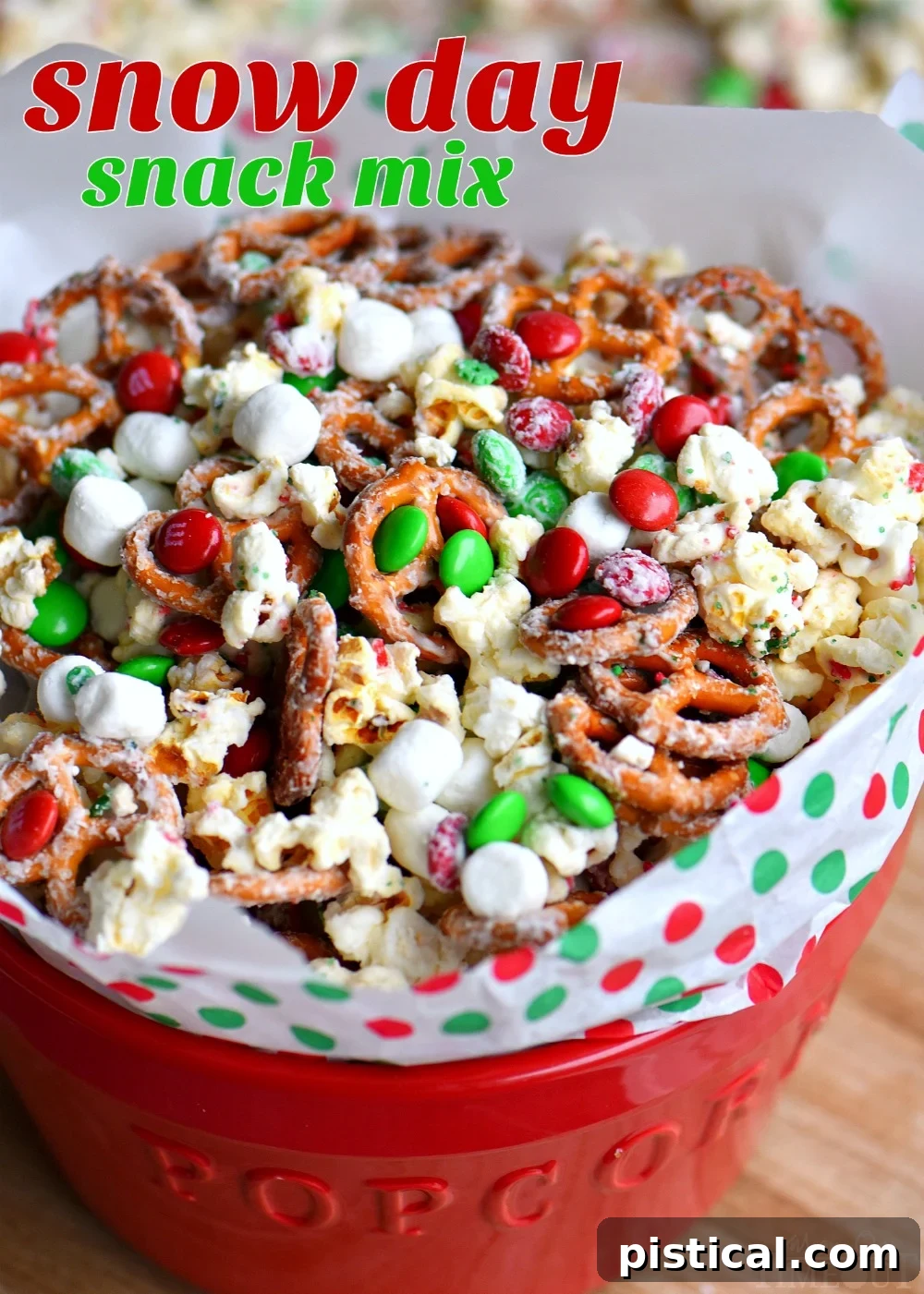 This wonderfully festive Snow Day Snack Mix is the perfect easy treat all winter long! Both sweet and salty, this holiday snack mix is great for Christmas, movie nights, parties, gifts and so much more! A bowl of snowy white snack mix with red and green M&M's, pretzels, and marshmallows. // Mom On Timeout #christmas #dessert #snack #pretzels #marshmallows #redandgreen #momontimeout