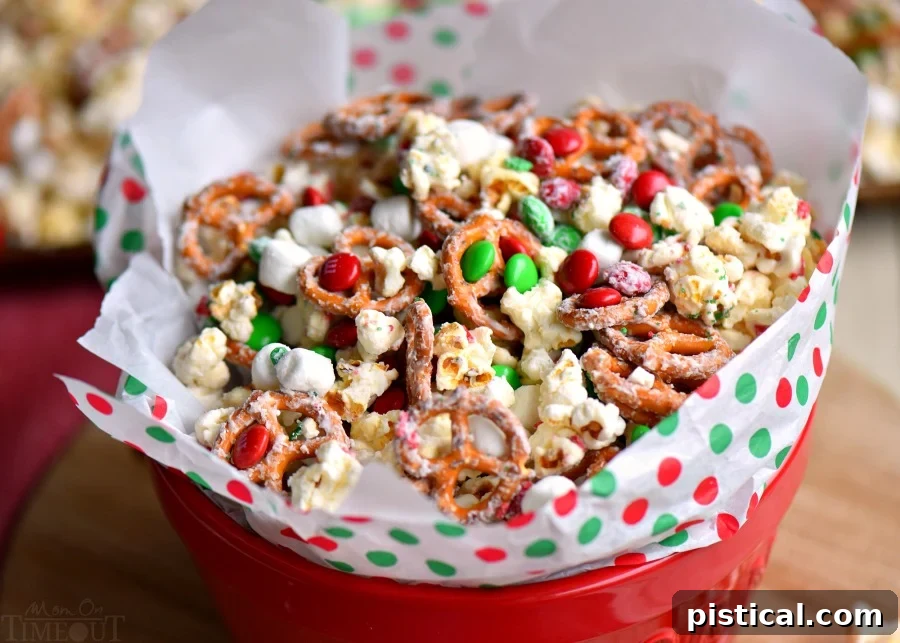 This delicious Snow Day Snack Mix is the perfect easy treat all winter long! Both sweet and salty, this holiday snack mix is great for Christmas, movie nights, parties, gifts and so much more! A festive bowl of Snow Day Snack Mix, ready to be served. 