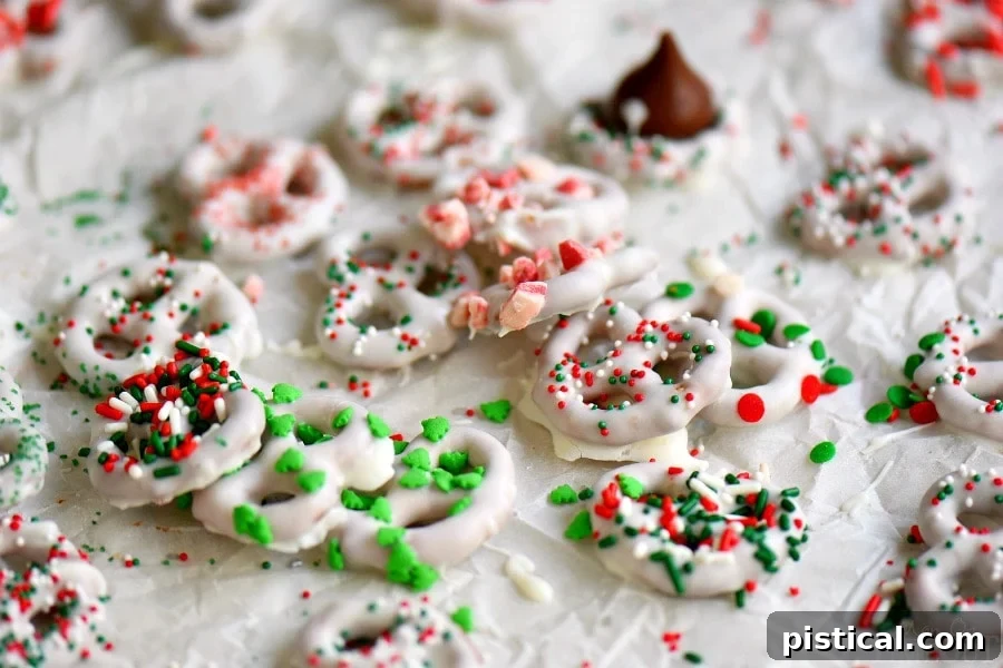 Perfectly dipped white chocolate pretzels, ready for holiday gatherings. Learn how to make these easy and festive treats.