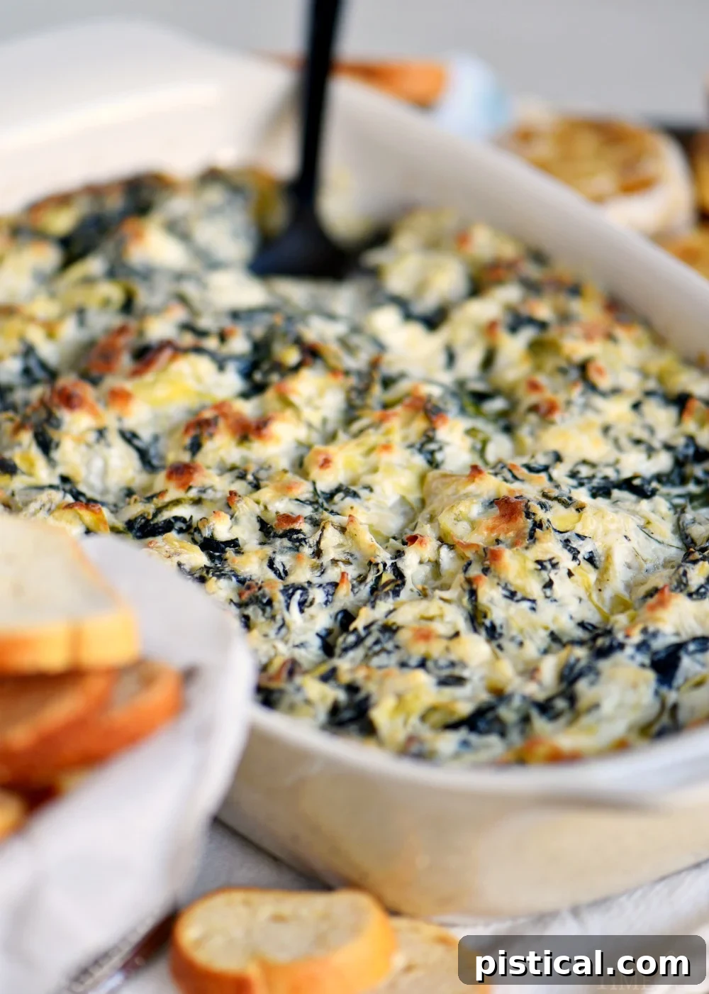 best-spinach-artichoke-dip-in-dish-with-spoon