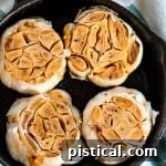 Roasted garlic heads, golden brown and ready to be squeezed.