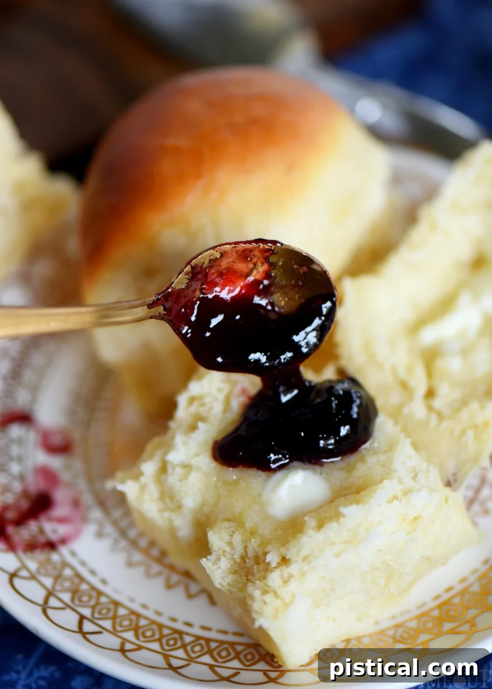 Homemade dinner rolls served with butter and jelly
