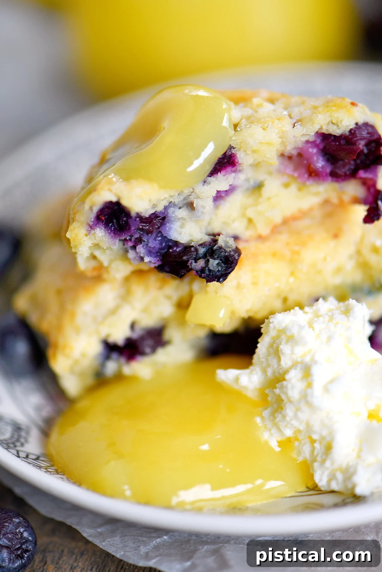 Zesty Lemon Blueberry Scones 5 Lemon Blueberry Scones served with a bowl of lemon curd and fresh cream