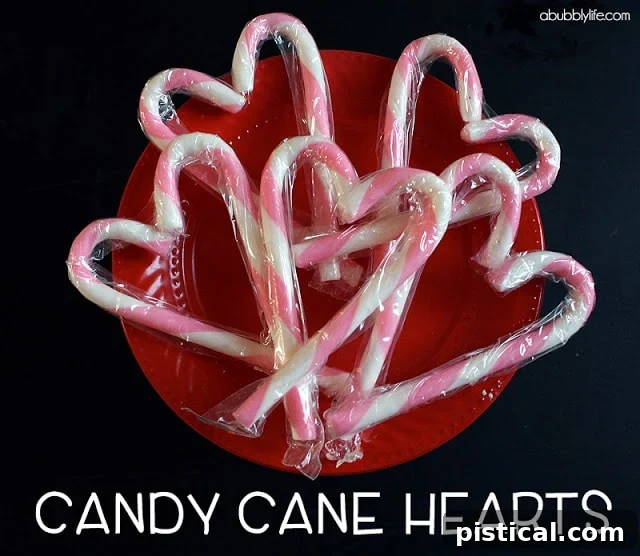 candycanes Heart-shaped candy cane ornaments or party favors, crafted by gently warming and shaping candy canes, symbolizing holiday love and sweetness.