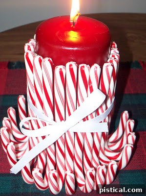 Candy Cane Candle Decorative candy cane candles, designed to look like festive peppermint treats, adding a warm, inviting, and fragrant glow to any room during the holidays.