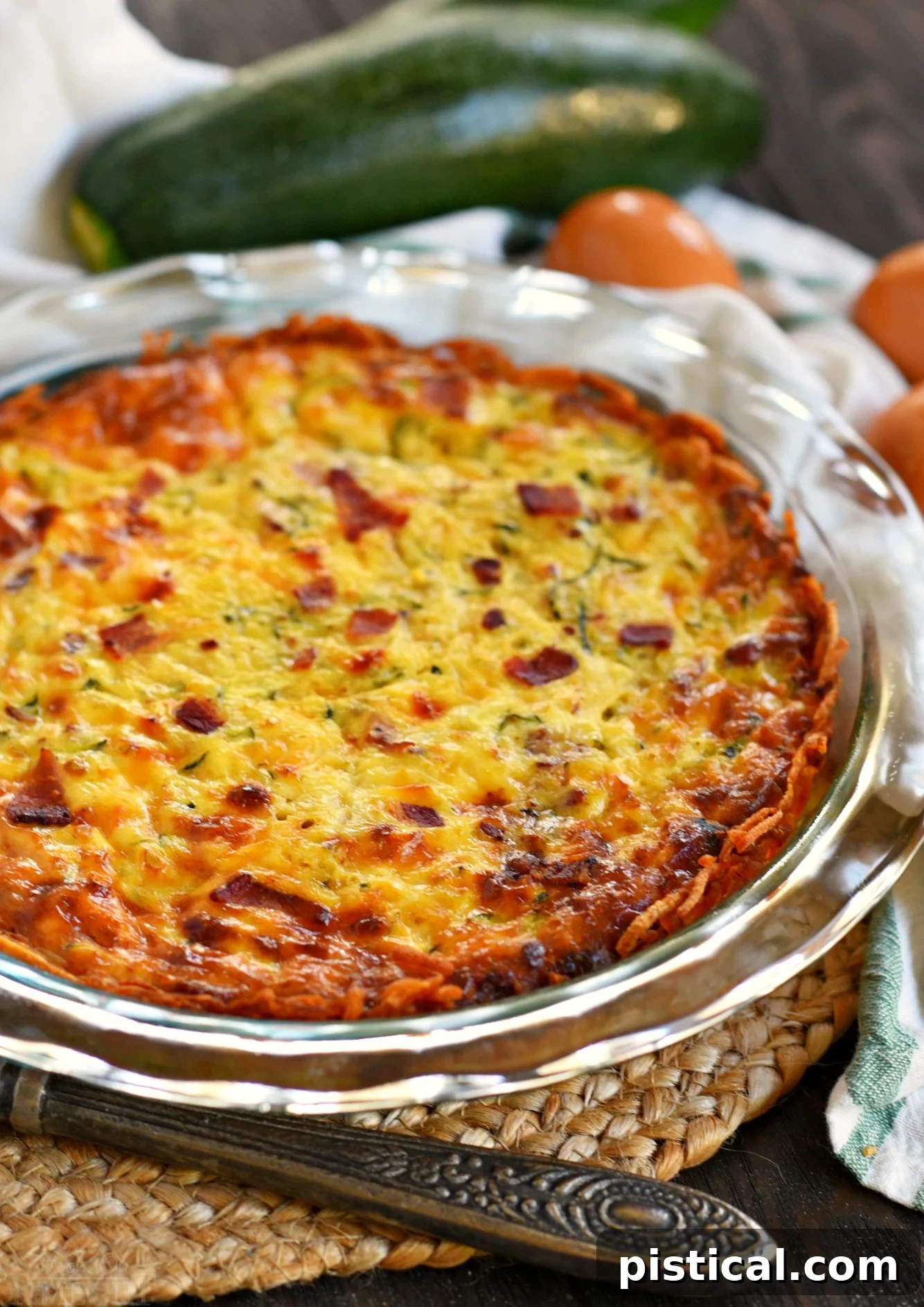 Whole Zucchini Quiche with Bacon and Hash Brown Crust in pie plate