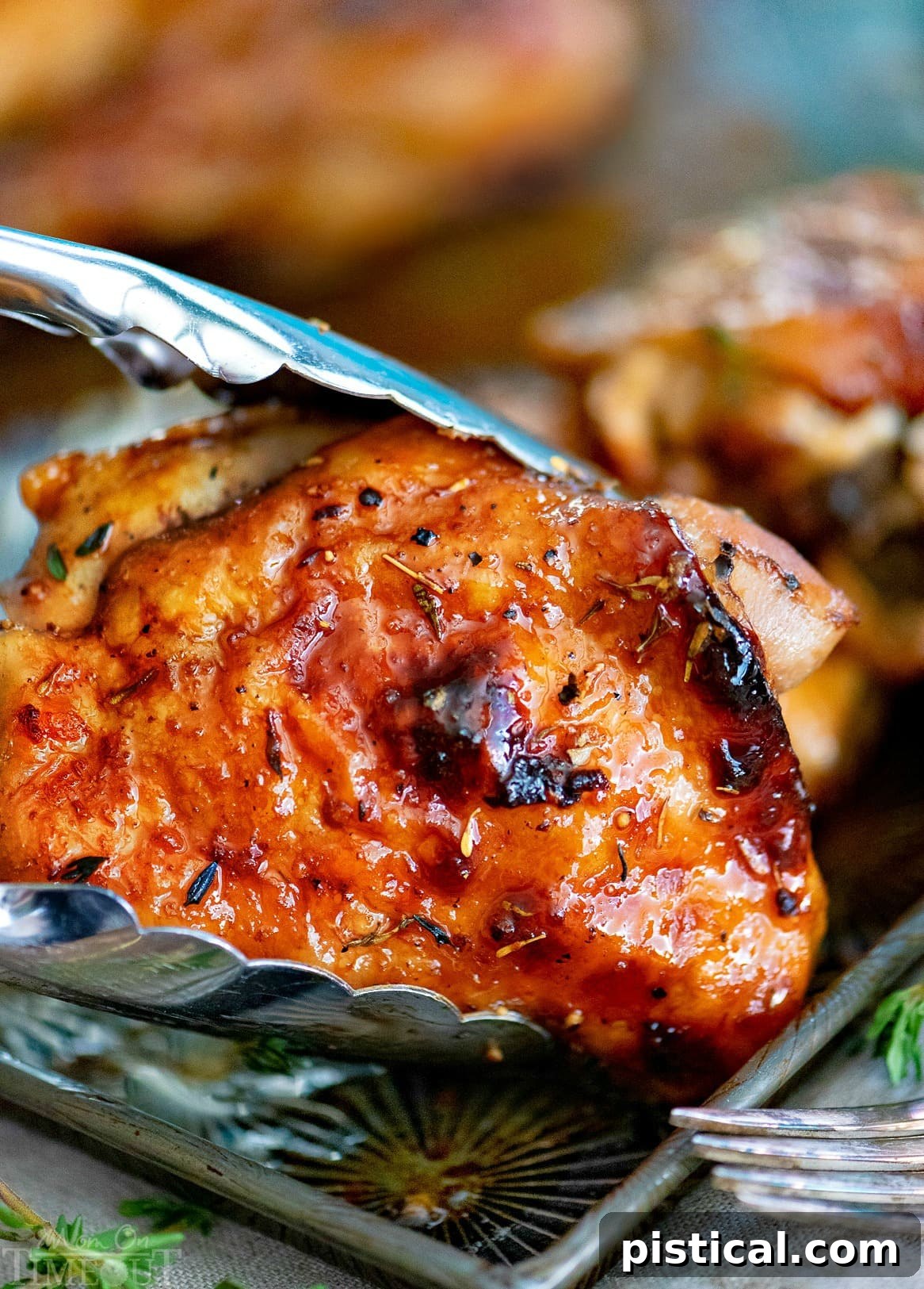 Delicious glazed honey balsamic chicken on a baking sheet, fresh from the oven, perfect for an easy weeknight meal.
