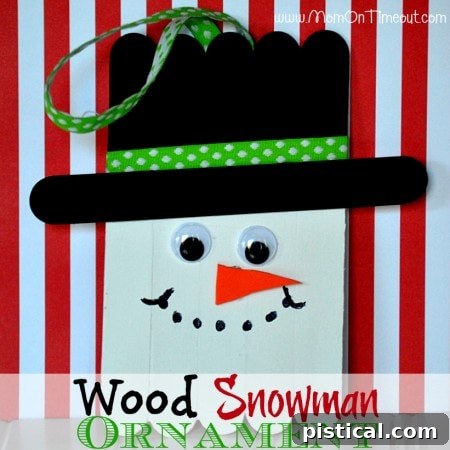 Two cheerful Wood Snowman Ornaments made from craft sticks, a perfect Christmas activity for children and families.
