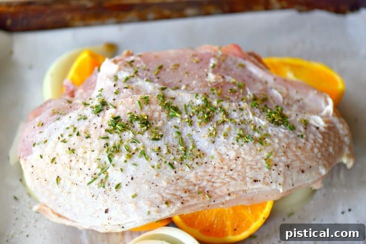Ingredients for roast turkey breast laid out on a sheet pan
