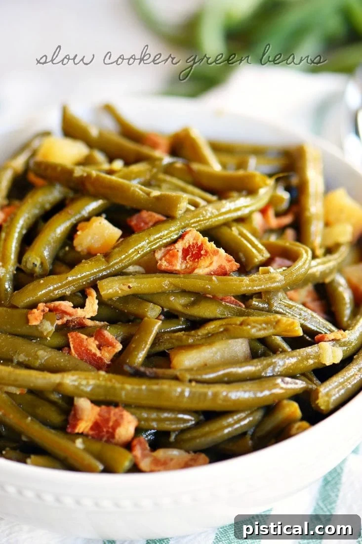 Delicious Slow Cooker Green Beans with Bacon and Potatoes ready to serve in a white bowl