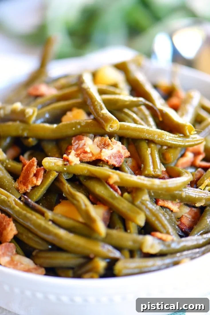 Plated Slow Cooker Green Beans with Bacon, a spoonful ready to be eaten