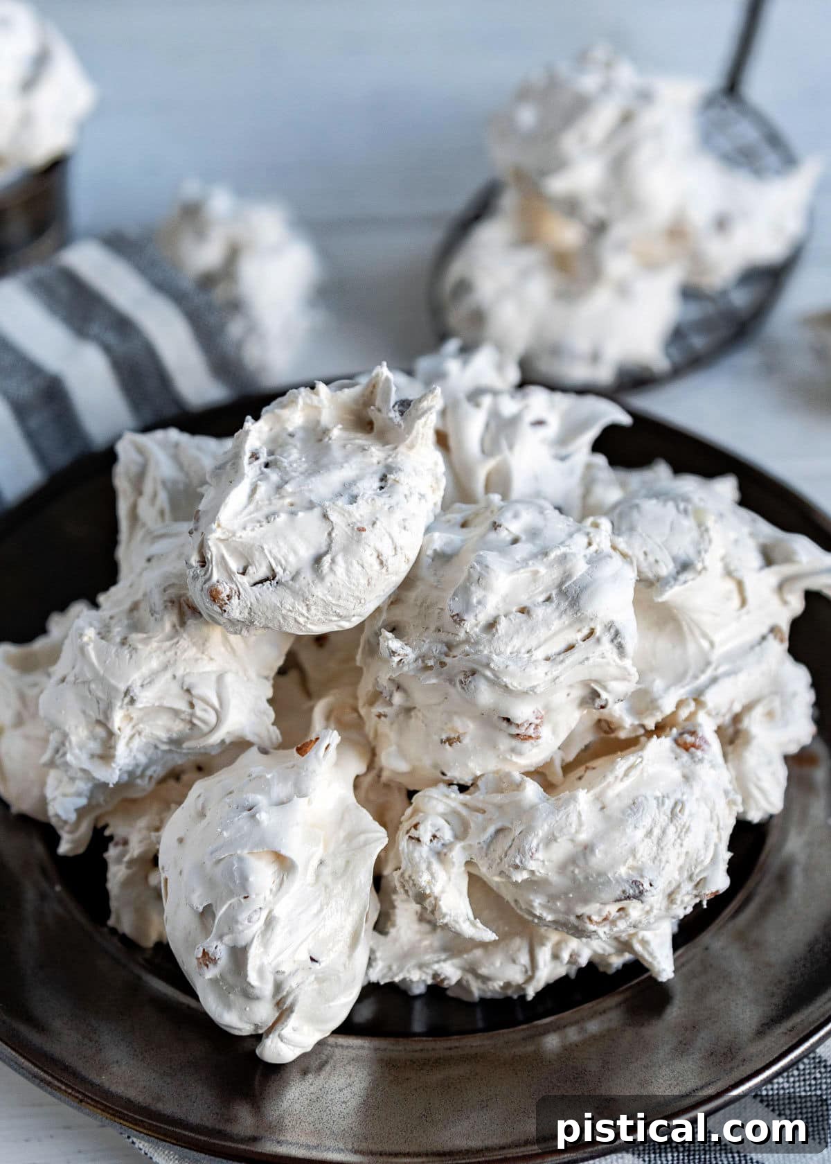 silver plate topped with lots of divinity candy piled high ready to be enjoyed.