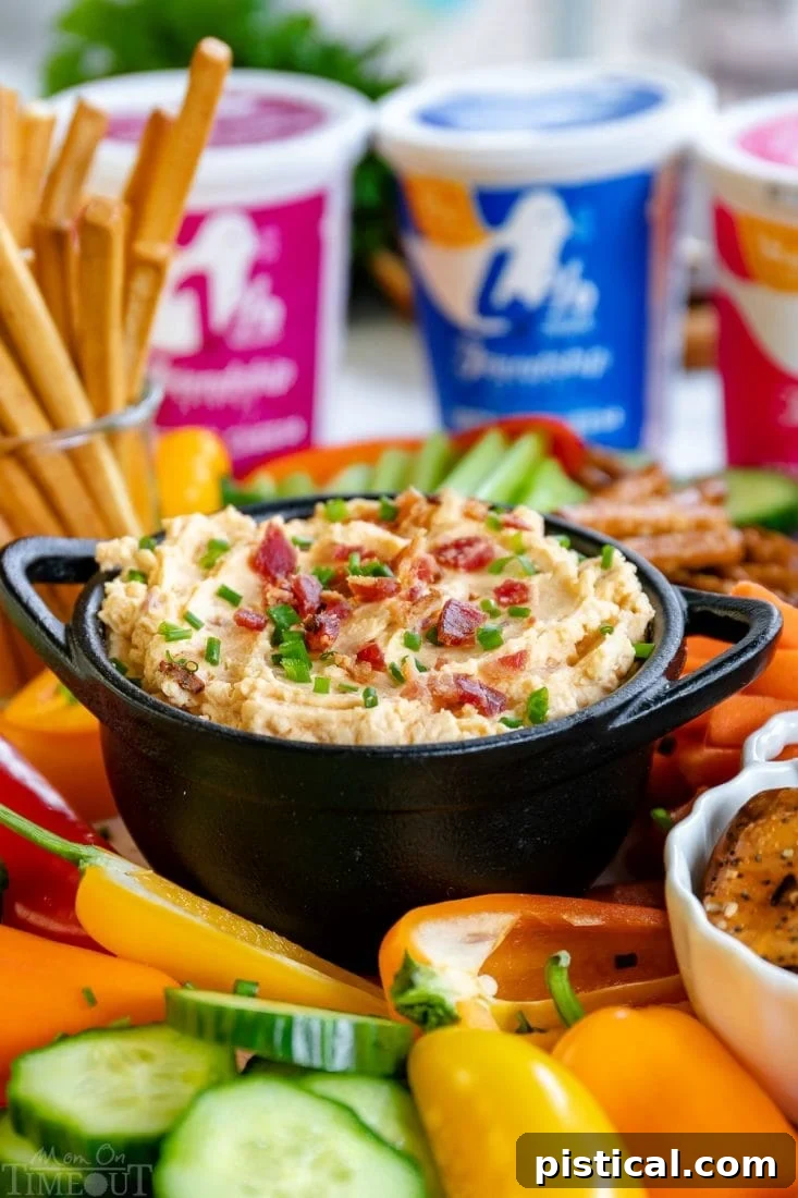 Close-up of Cold Beer Cheese Dip with a spoon, highlighting its creamy texture