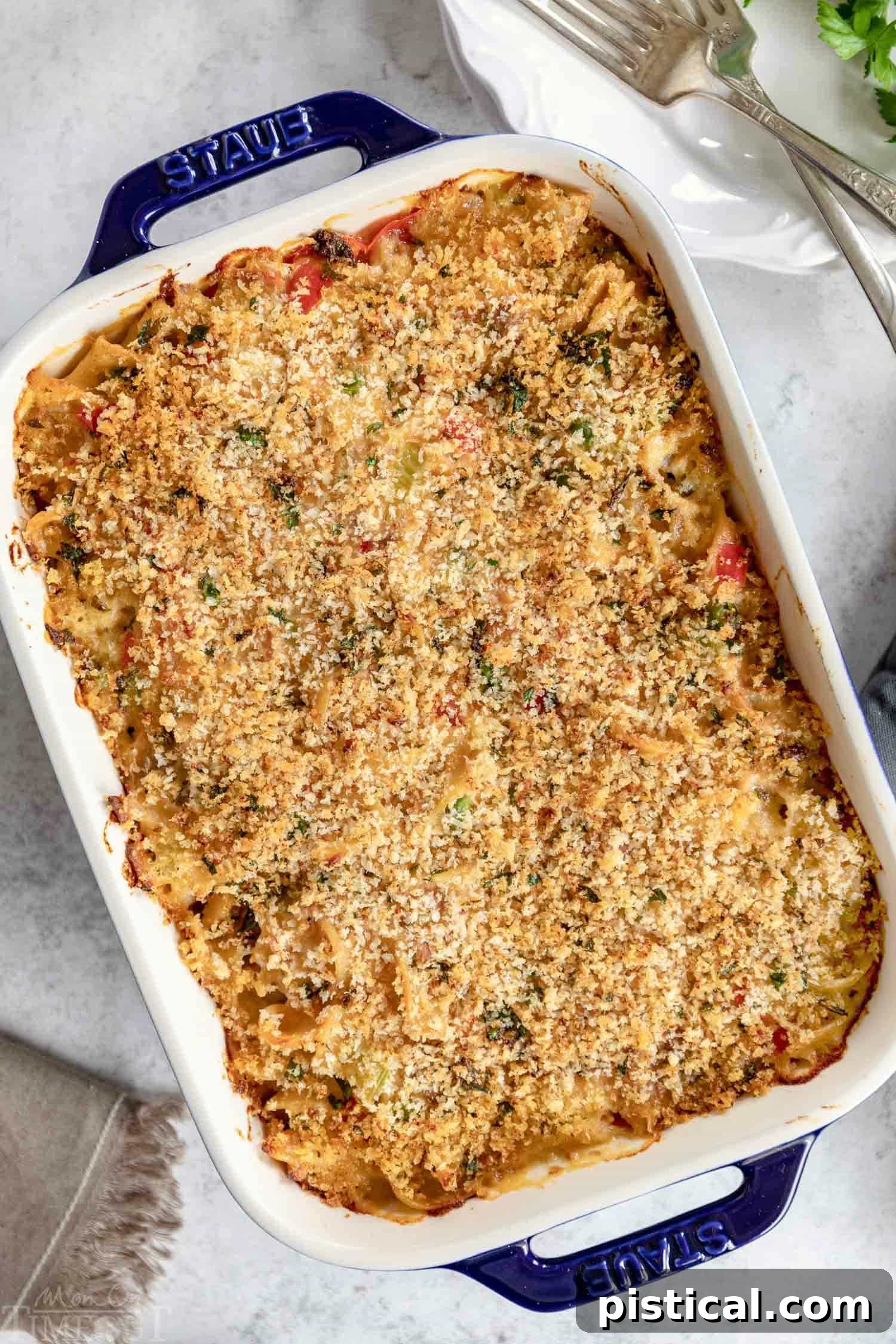 Freshly baked tuna noodle casserole, bubbling and golden-brown, straight from the oven.