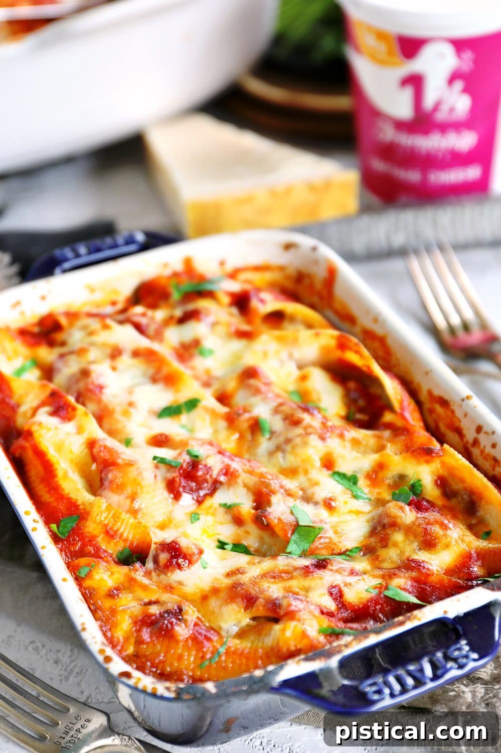 Individual portion of stuffed shells in a small baking dish. stuffed-shells-small-baking-dish