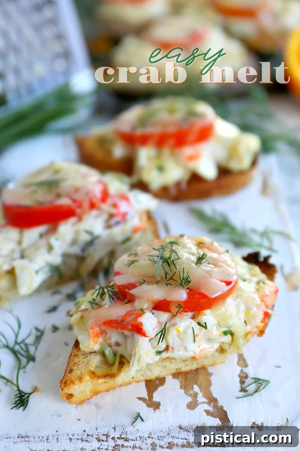 Delicious Easy Crab Melts prepared on sourdough bread with fresh crab, herbs, tomato, and melted Gruyere cheese, garnished and ready for serving at an elegant gathering.
