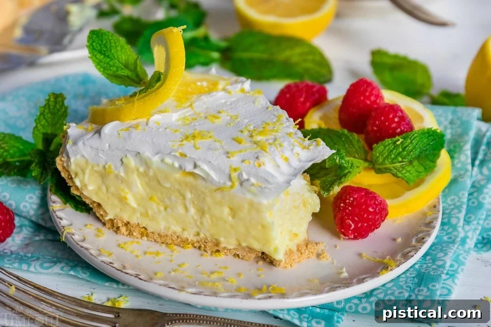 A delectable piece of No Bake Lemon Pie with a small bite taken out, showcasing the smooth filling and crumbly crust.