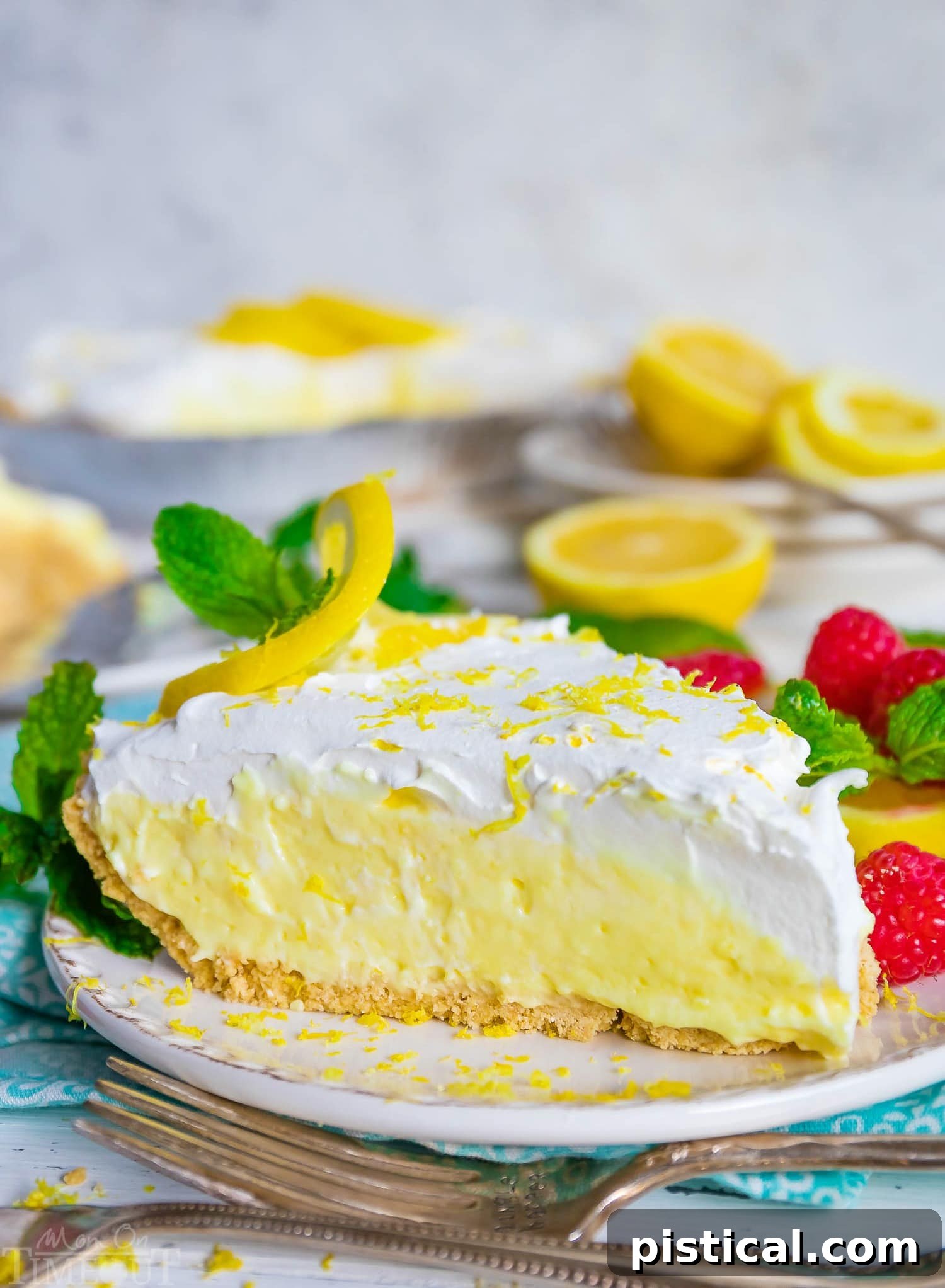 A pristine slice of creamy No Bake Lemon Pie served elegantly on a white plate, ready to be enjoyed.