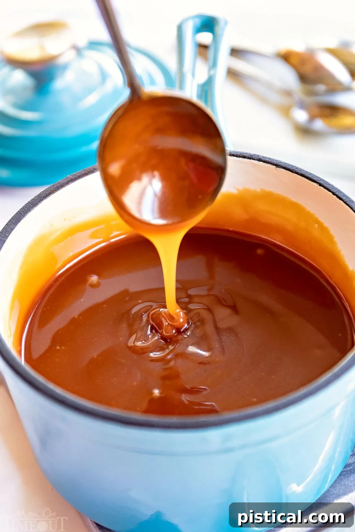 Caramel sauce bubbling in a saucepan on the stove