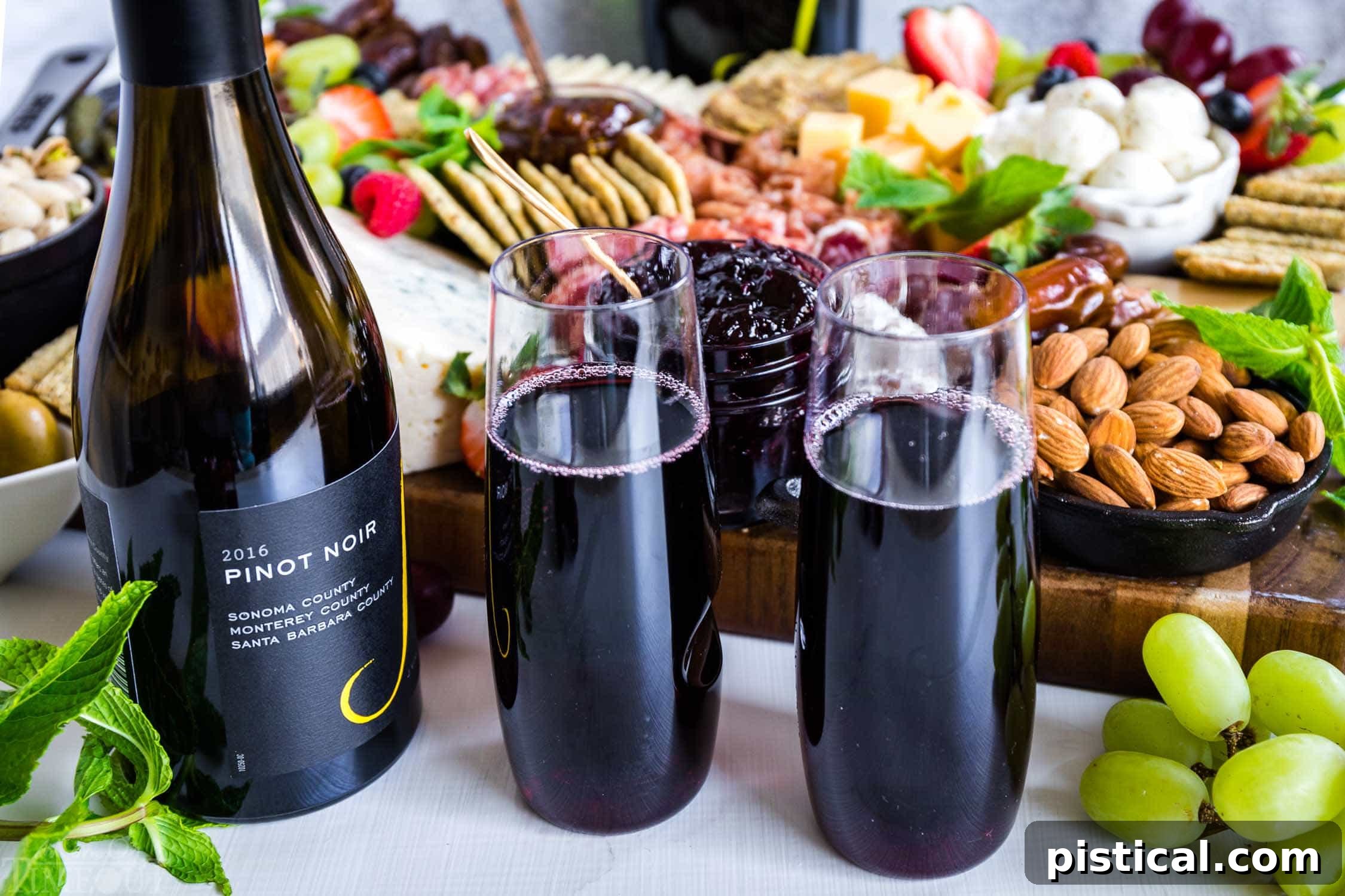 Elegant display of Pinot Noir glasses, ideal for wine pairing with charcuterie. Glasses of J. Winery Pinot Noir arranged beautifully.