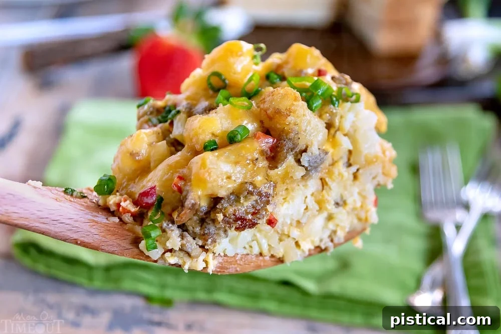Warm and inviting scoop of Slow Cooker Tater Tot Breakfast Casserole, straight from the crockpot. A serving spoon lifting a generous scoop of hot and cheesy Slow Cooker Tater Tot Breakfast Casserole from the slow cooker, steam rising.