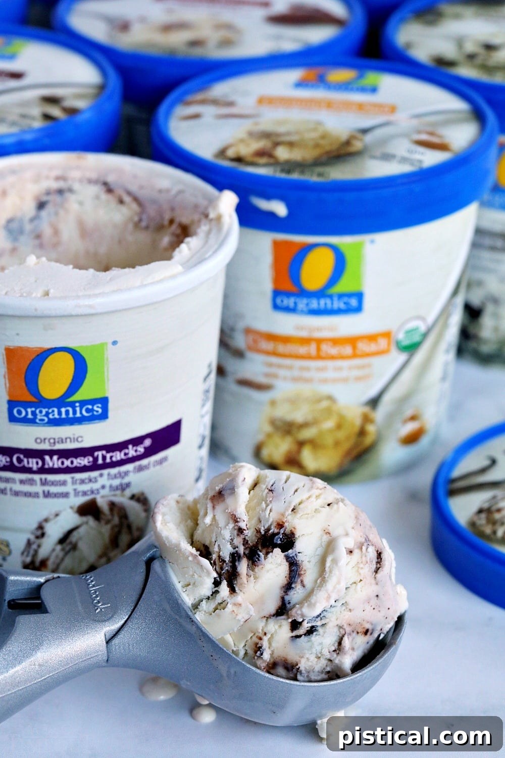 Hands holding a scoop of O Organics ice cream