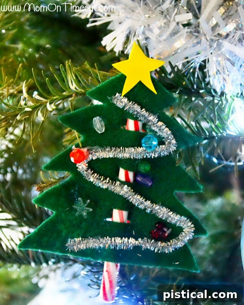 A collection of finished Candy Cane Christmas Trees displayed on a real Christmas tree, highlighting their versatility as ornaments.