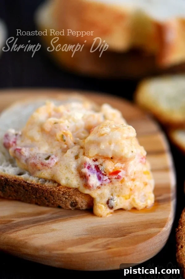 Creamy roasted red pepper shrimp scampi dip, bubbling hot and garnished with fresh parsley, served with crusty bread for dipping.