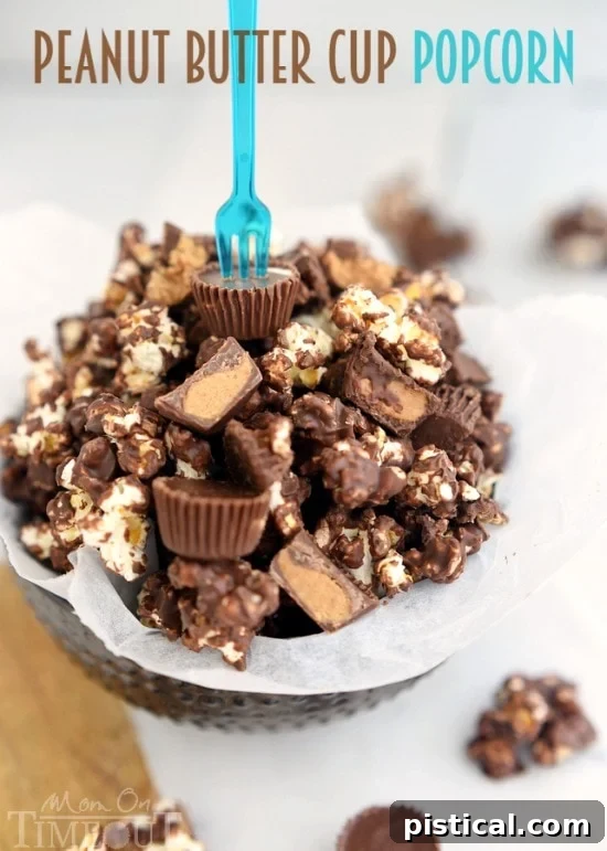 A bowl of homemade peanut butter cup popcorn, generously mixed with chopped Reese's Peanut Butter Cups for a sweet and salty treat.