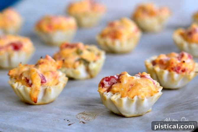 Freshly baked buffalo chicken bites in phyllo cups, hot from the oven