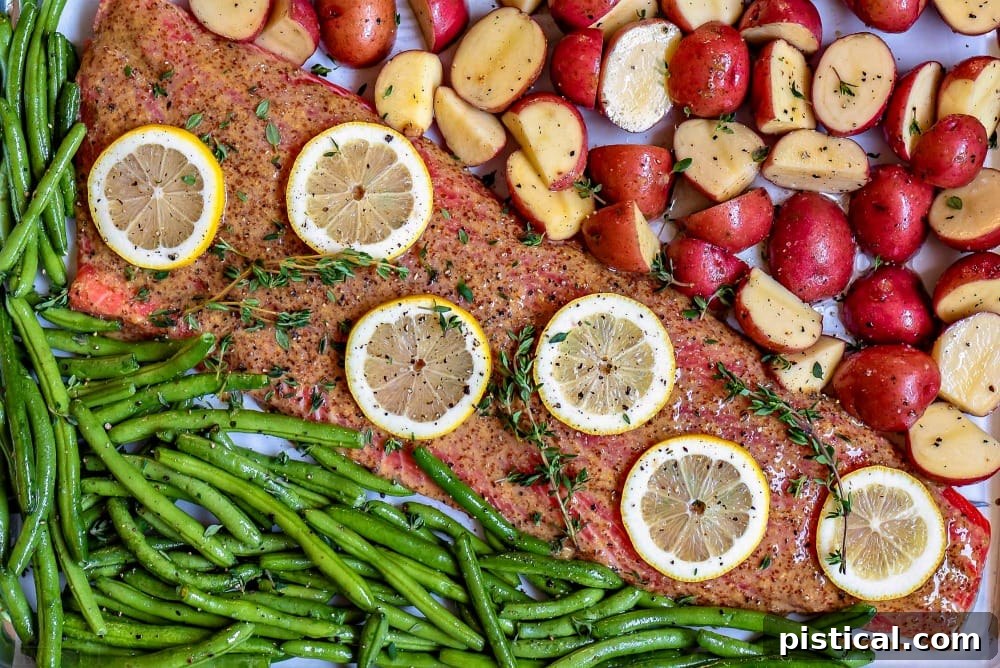 oven baked salmon recipe with honey dijon glaze on sheet pan