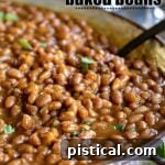 crockpot baked beans in metal serving dish