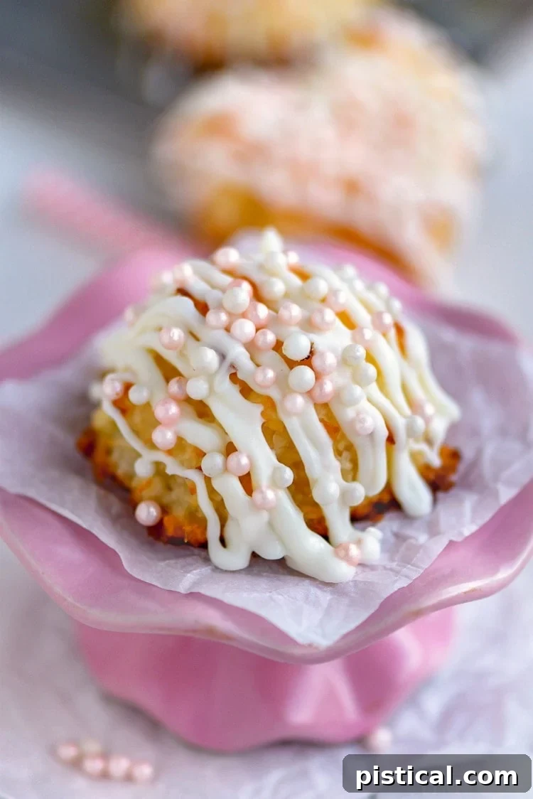Valentine's Day Coconut Macaroons with pink pearls on a charming pink cake stand