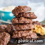 Effortless No-Bake Delights 8 no bake cookies stacked on brown cutting board