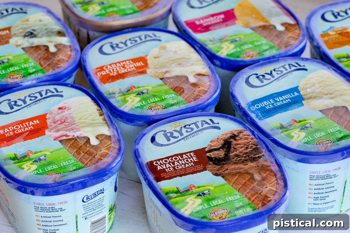 Side-by-side comparison of Crystal Creamery ice cream containers, highlighting their updated packaging and range of flavors.