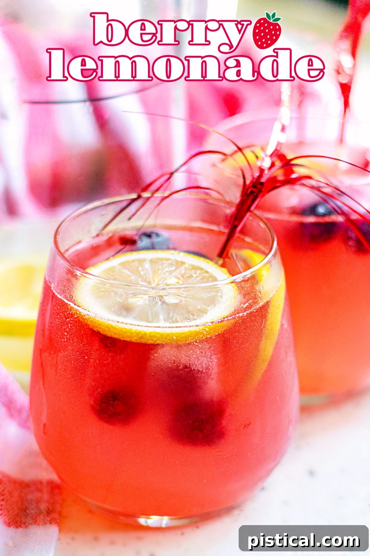 A glass of Berry Lemonade garnished with fresh lemon slices, ready to be enjoyed on a hot day.