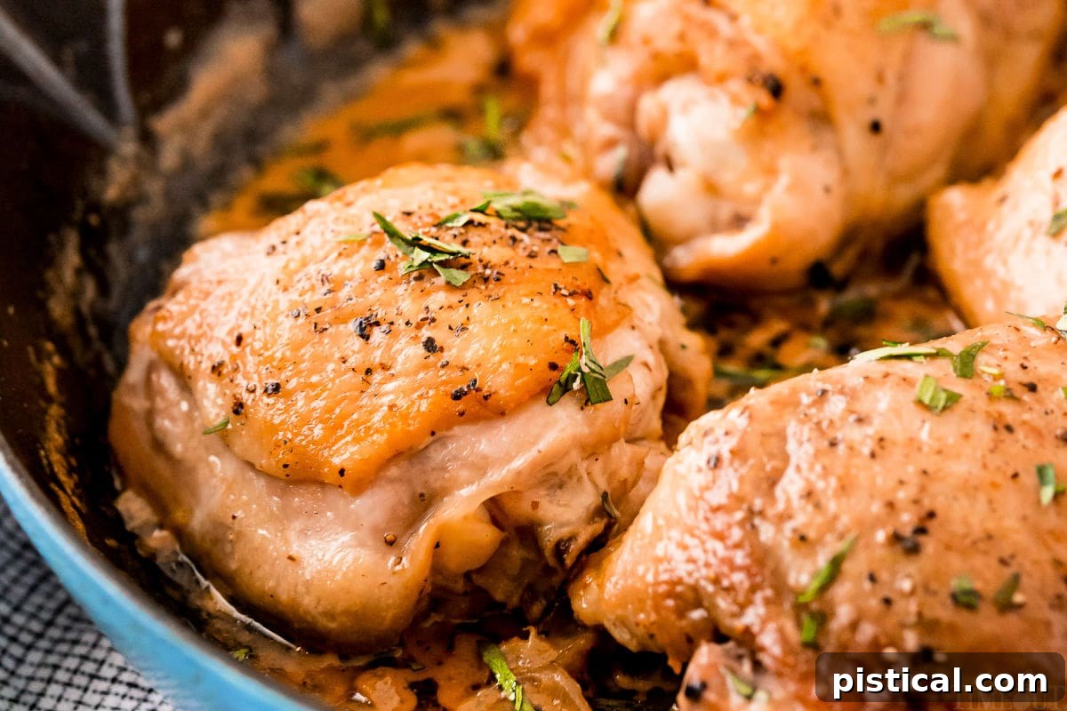 Velvety Mustard Chicken Bake 6 baked chicken thighs with mustard sauce on top in cast iron skillet