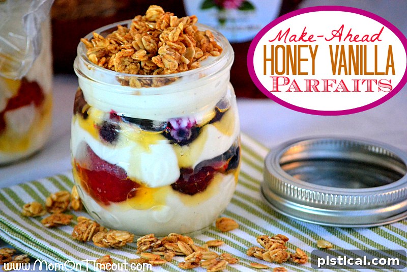 Close-up of a beautifully layered honey vanilla parfait, showcasing fresh berries, creamy yogurt, and crunchy granola in a glass jar. This ready-to-eat parfait is ideal for a grab-and-go morning meal.