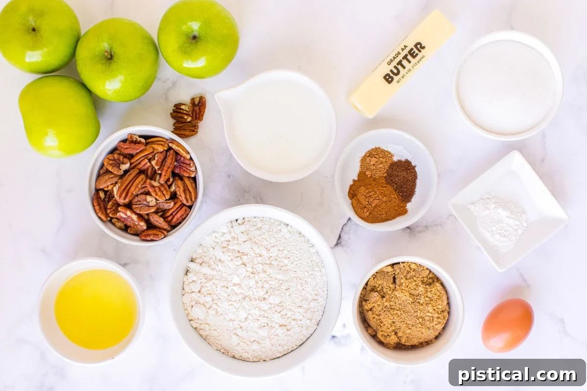apple muffin ingredients measured out into small bowls sitting on white surface
