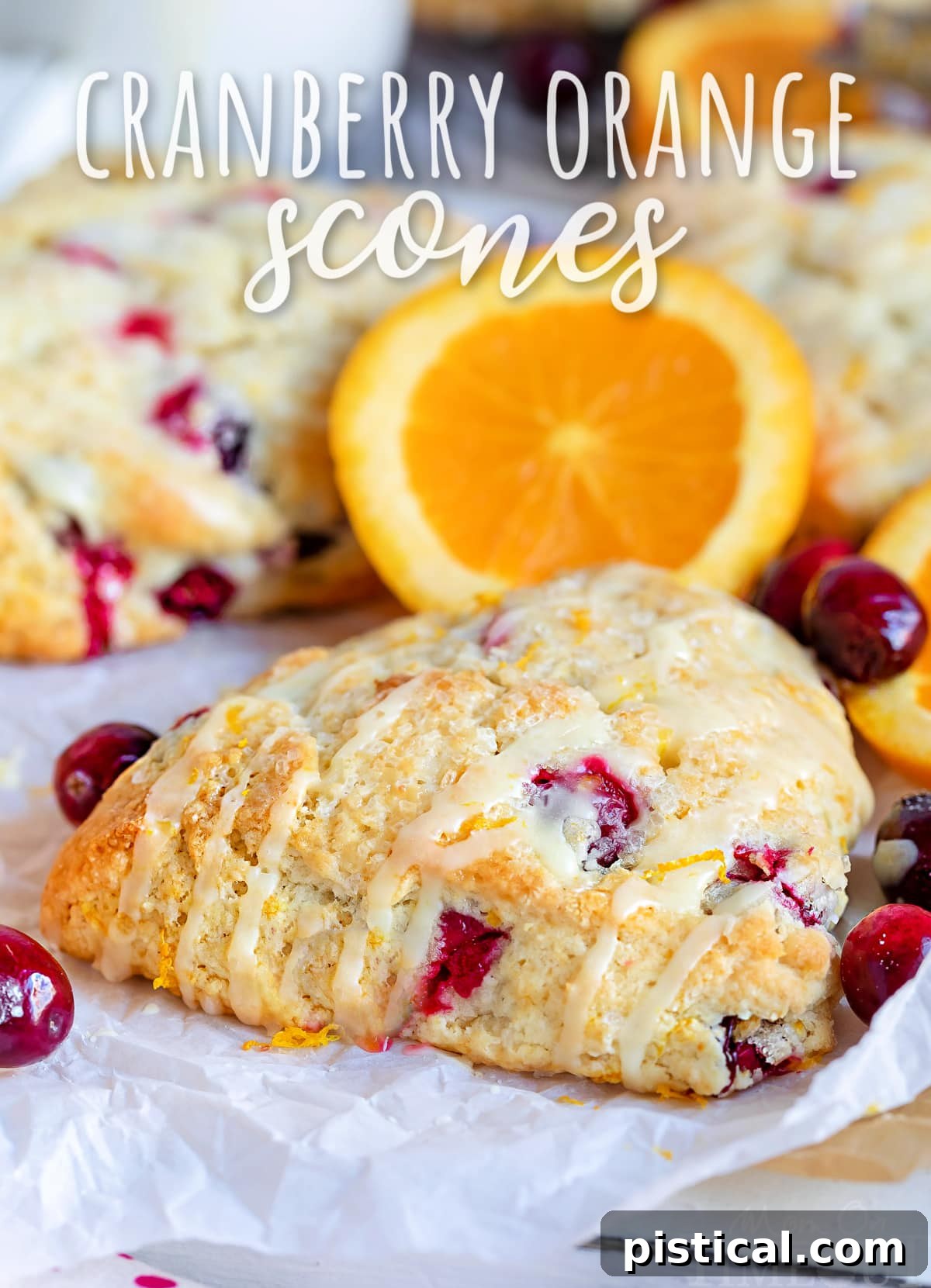 Perfect Cranberry Orange Scone with orange glaze drizzled on top, ready to be enjoyed
