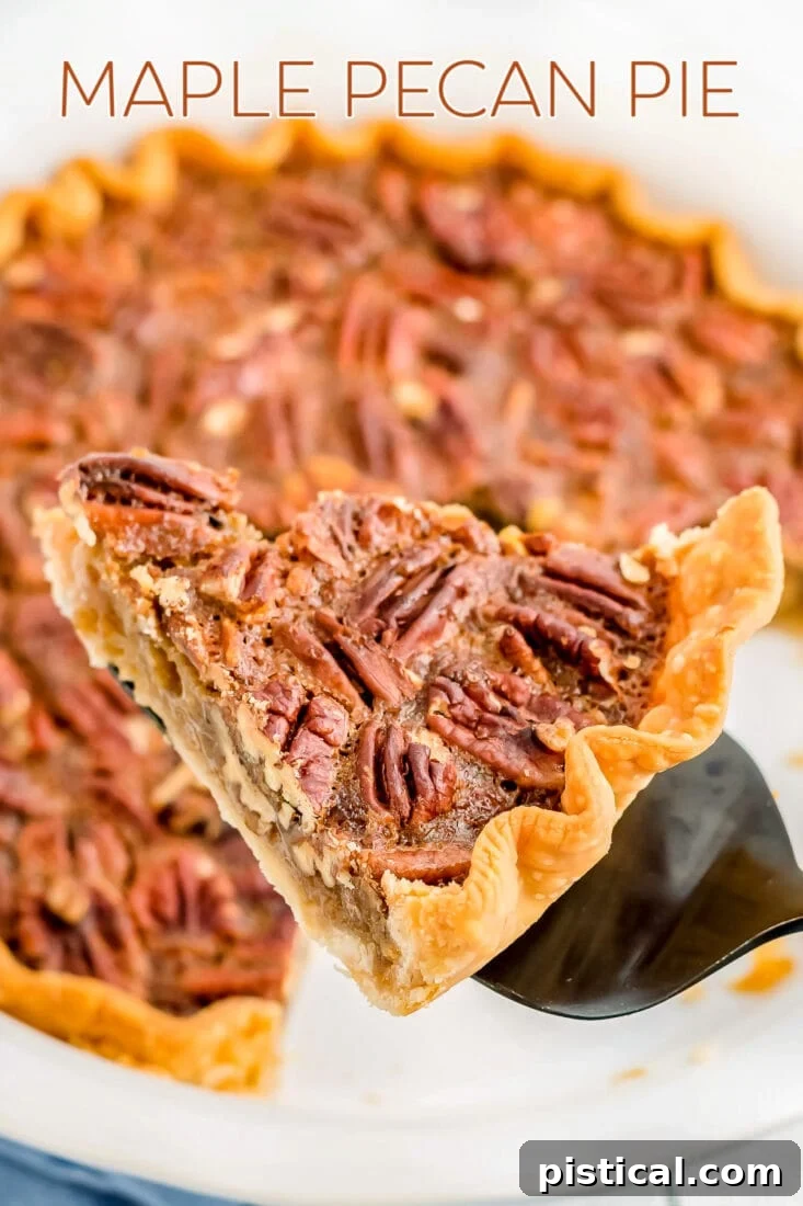 A beautifully sliced maple pecan pie on a server, with the whole pie in the background, ready to be enjoyed.