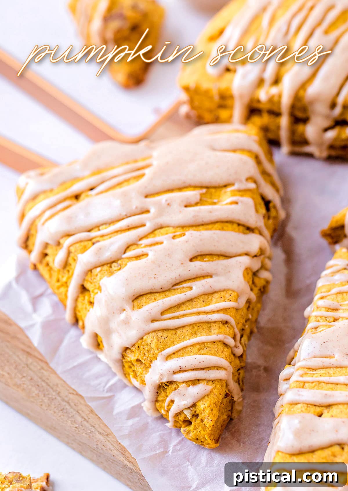 Autumn Spiced Pumpkin Scones with Maple Drizzle 2 close-up of pumpkin scones with maple pumpkin pie spice drizzle on top, ready to be served