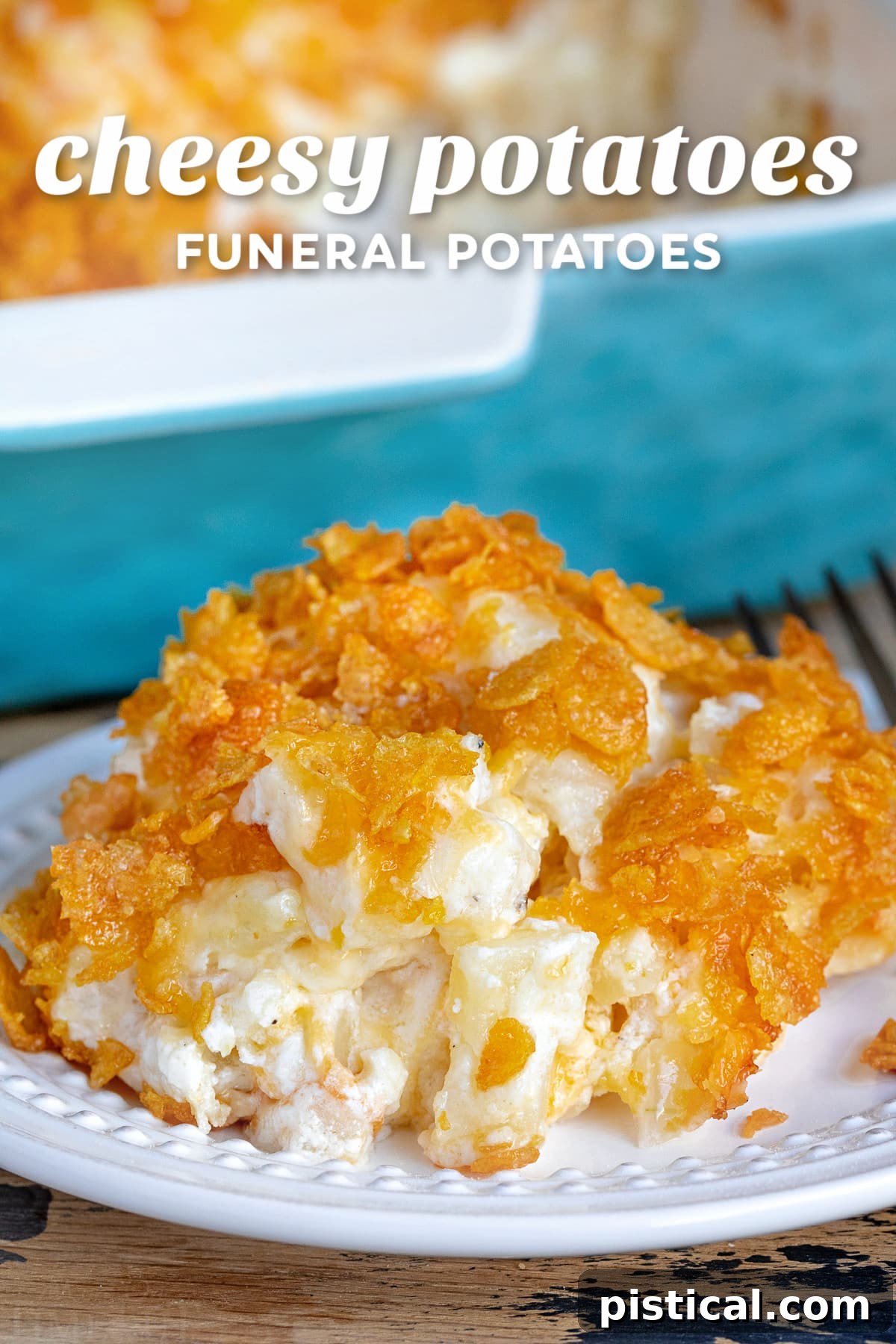 Homestyle Cheesy Potato Casserole 2 A serving of cheesy potatoes on a white plate, with a full casserole dish blurred in the background, hinting at a delicious holiday meal.