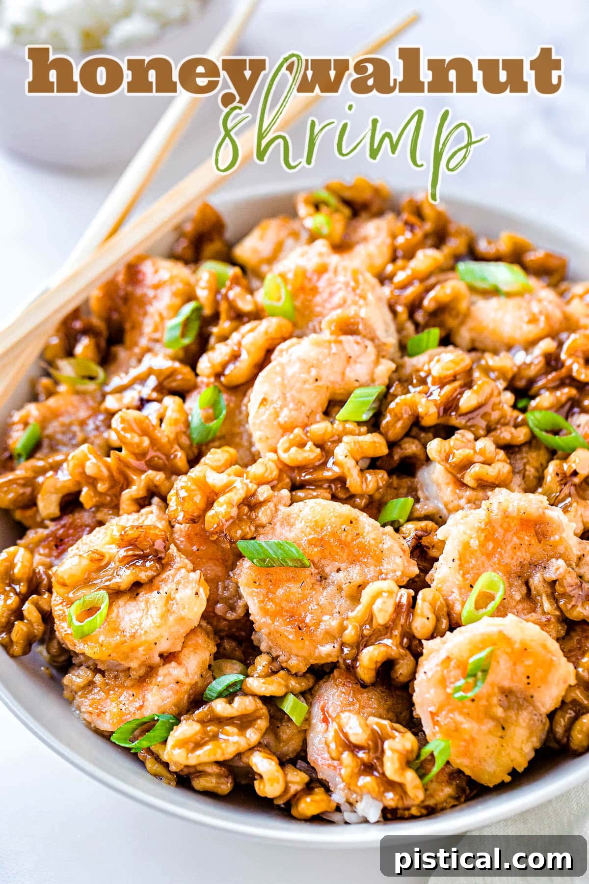 Sweet & Savory Walnut Shrimp Delight 2 A beautifully plated bowl of Honey Walnut Shrimp, garnished with fresh green onions, with chopsticks resting on the side, ready to be enjoyed.