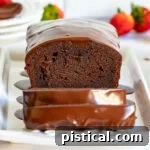 Decadent Chocolate Loaf 13 A perfectly baked chocolate pound cake, rich and dark, ready to be sliced and enjoyed.