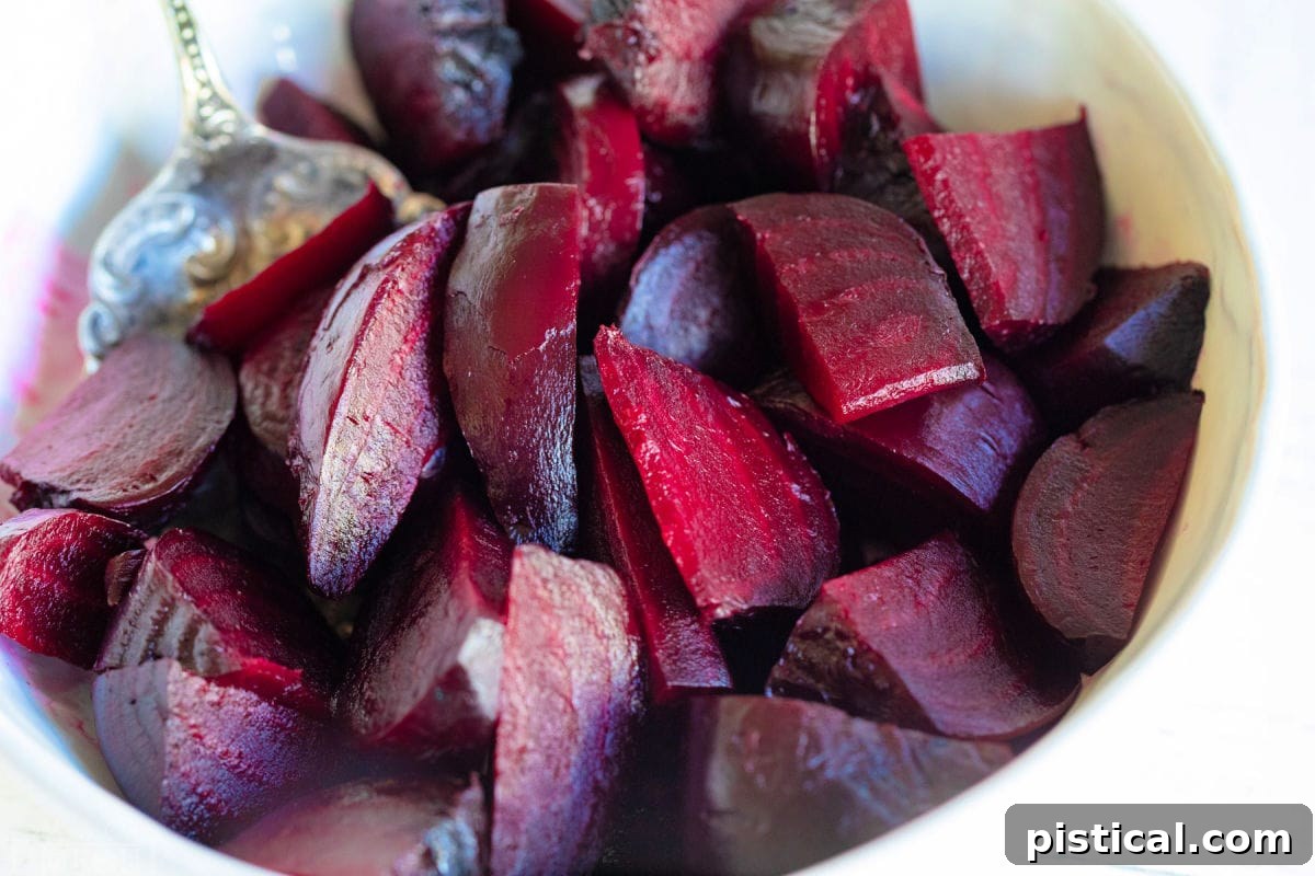How to Make Perfect Roasted Beets 6 Roasted beets, peeled and cut into small pieces, presented in a large white serving bowl.
