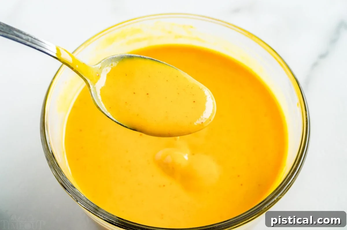 honey mustard in bowl with spoon.