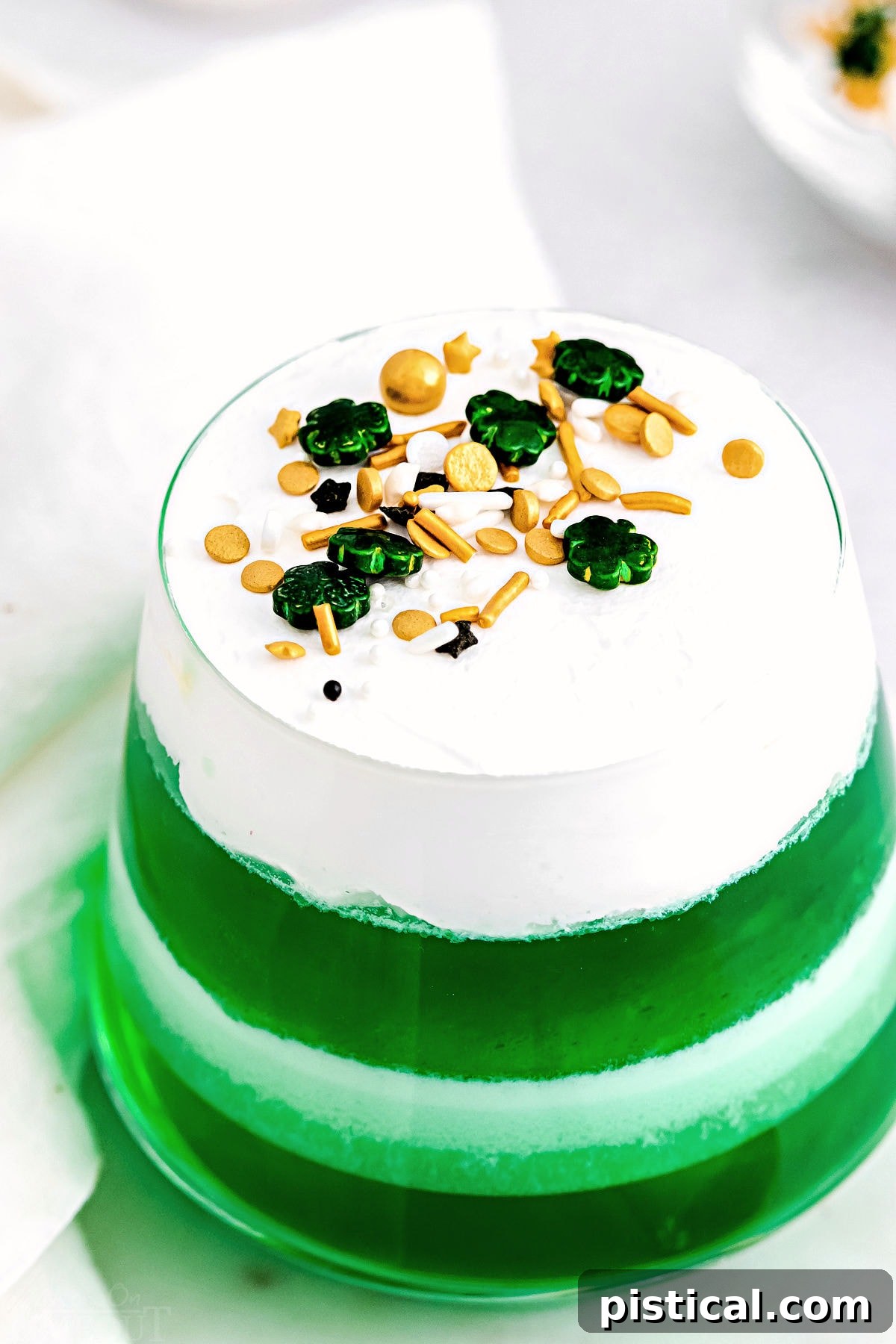 top down view of lime jello layered cups.